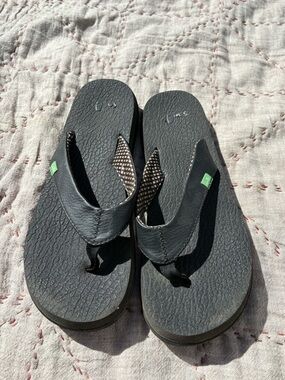 Black Leather-Look Flip Flop Sandals with Green Tag